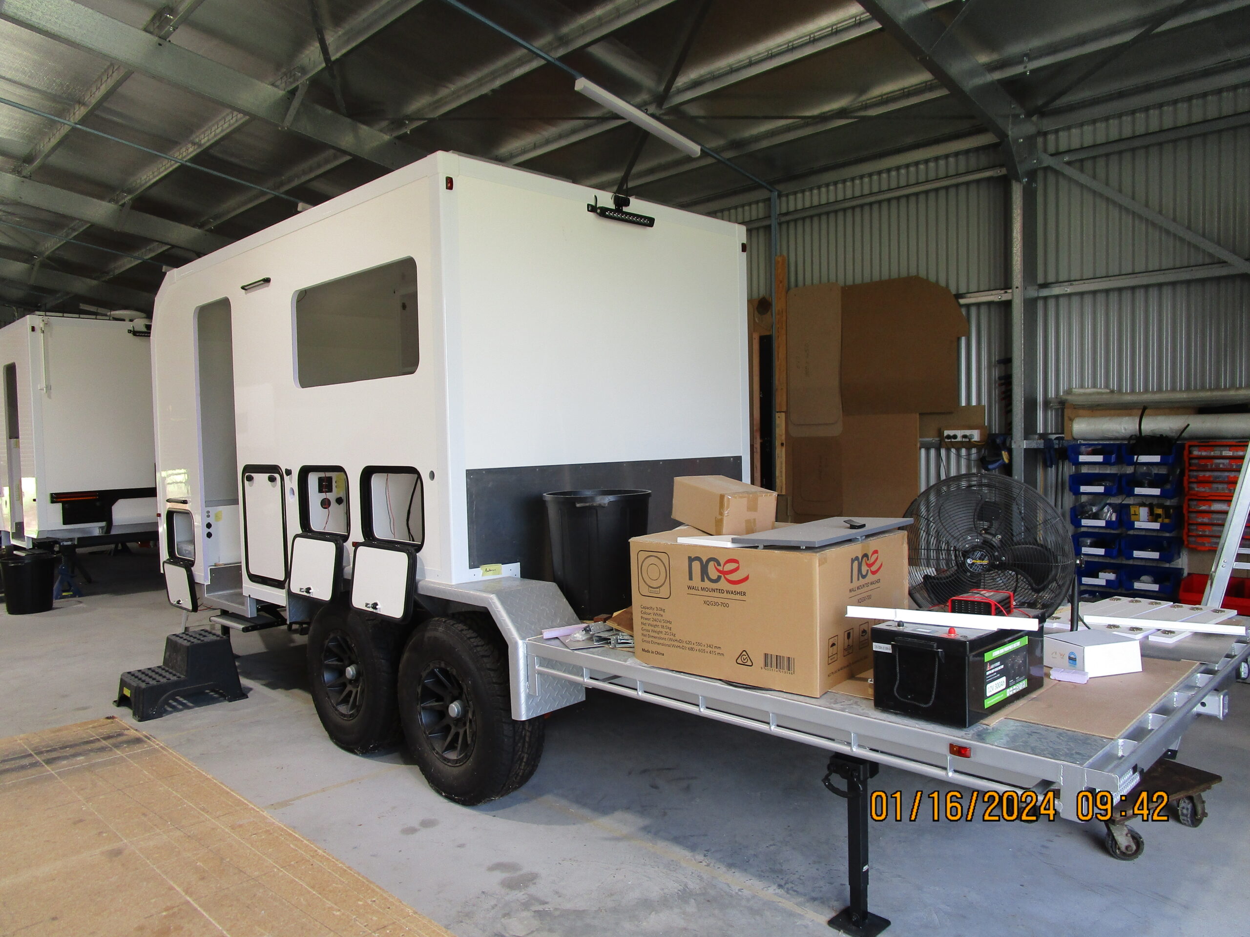 Custom Queensland caravan project with toy hauler design